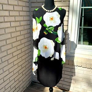 New dress without tag. Dress is fitted, stretchy and flower  overlay is loose.